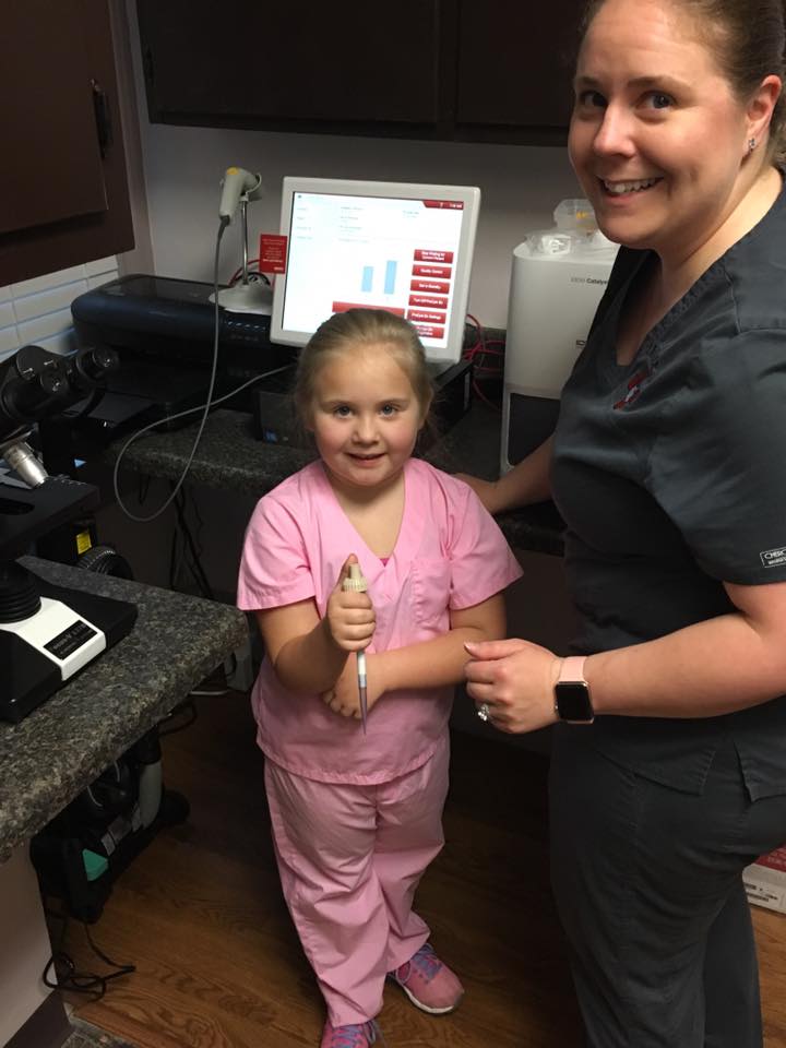 Dr. Shannon Miller and her daughter in the clinic