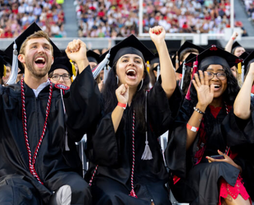 Graduating students celebrate during UGA’s spring 2023 commencement ceremonies at Sanford Stadium.