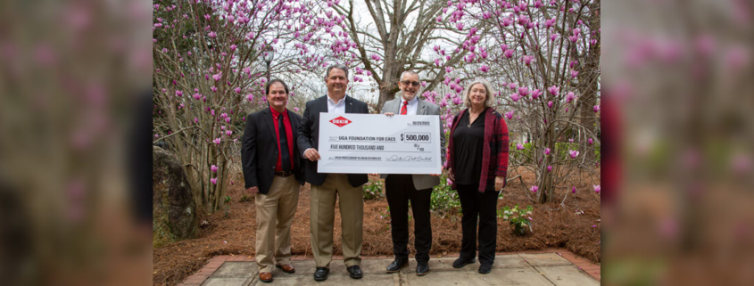 Standing with a ceremonial check to commemorate Orkin's $500,000 commitment to create a professorship in entomology are Dan Suiter, Orkin Professor of Urban Entomology and UGA Extension entomologist; Freeman Elliott, recently retired Orkin president and member of the CAES Advisory Council; Nick Place, CAES dean and director; and Kris Braman, professor and head of the CAES Department of Entomology. (photo: Lavi Astacio)