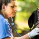 An employee checks on a goat at the Boehringer Ingelheim Goat Farm. (PHOTO: Edwin Hammond)